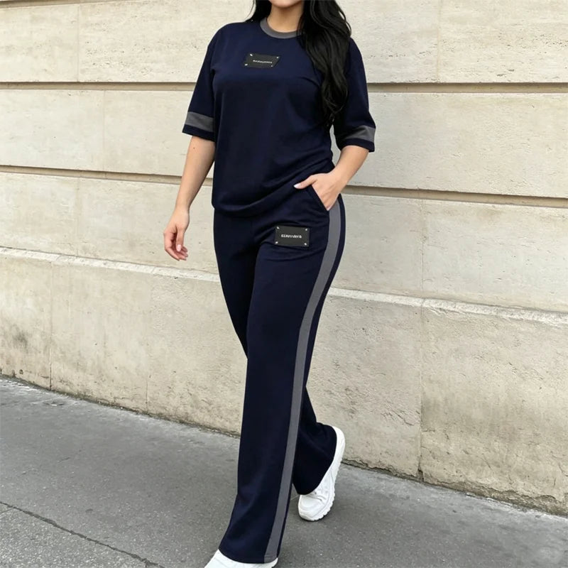 Damski dwuczęściowy dres letni: koszulka w stylu casual z kontrastowym paskiem i długie spodnie sportowe; materiał cienki, przewiewny i przyjemnie chłodny.